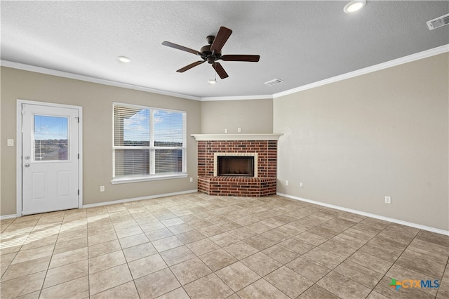 unfurnished living room featuring ceiling fan, light tile patterned floors, ornamental molding, and a brick fireplace