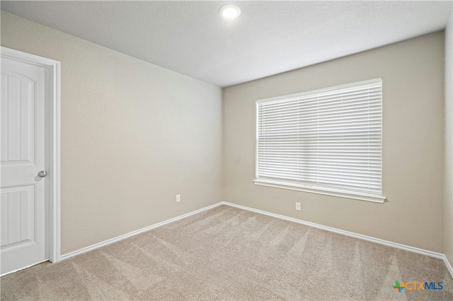 spare room with carpet flooring