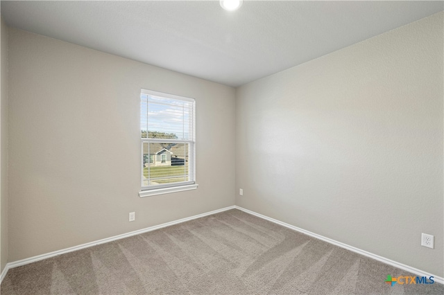 unfurnished room featuring carpet floors