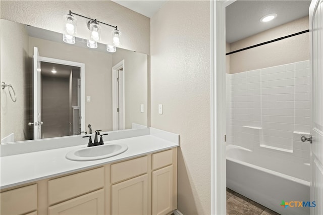 bathroom with vanity and bathtub / shower combination