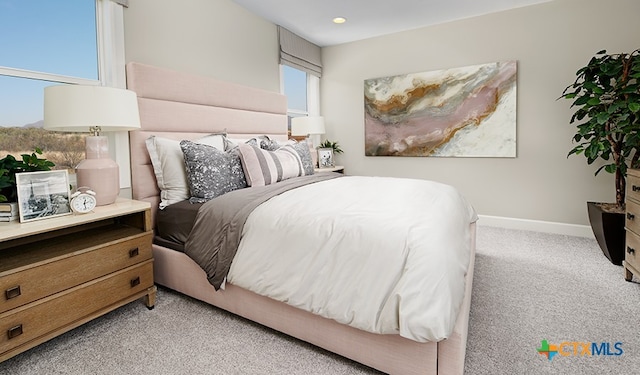 bedroom featuring light colored carpet