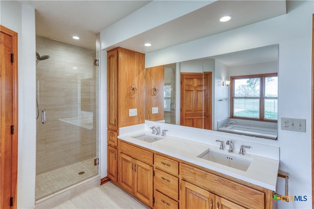 614 County Road 207, Burnet, TX 78611 - bathroom featuring a stall shower, recessed lighting, double vanity, and a garden tub