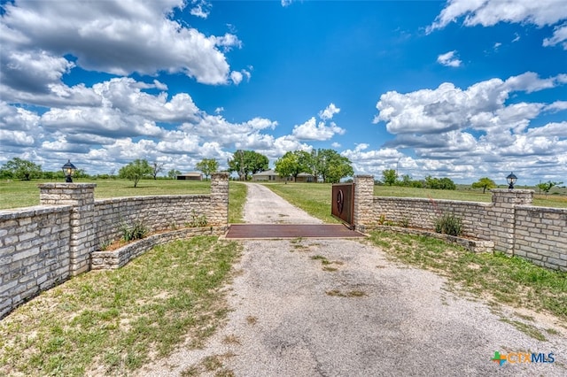 614 County Road 207, Burnet, TX 78611 - view of dirt / gravel road featuring a gated entry