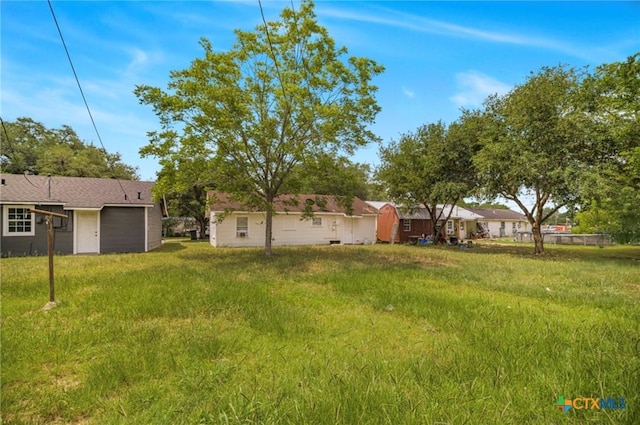 205 E Johnson St, Cuero, TX 77954 - view of yard with an attached garage