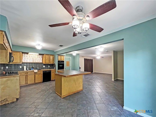 kitchen featuring black appliances, crown molding, backsplash, tile counters, and ceiling fan