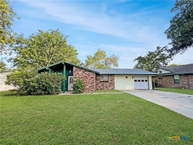 ranch-style home featuring a garage and a front yard