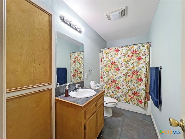 full bathroom with toilet, shower / tub combo with curtain, vanity, and tile patterned floors