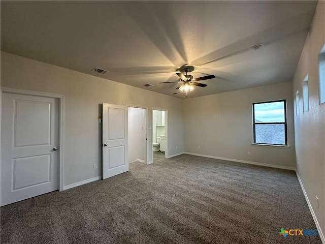 unfurnished bedroom featuring ceiling fan, carpet flooring, and ensuite bathroom