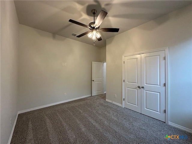 unfurnished bedroom featuring carpet, a closet, and ceiling fan