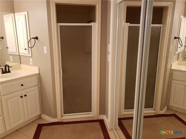 3512 Magnolia Blvd, Temple, TX 76502 - bathroom featuring vanity, a shower stall, baseboards, and tile patterned floors