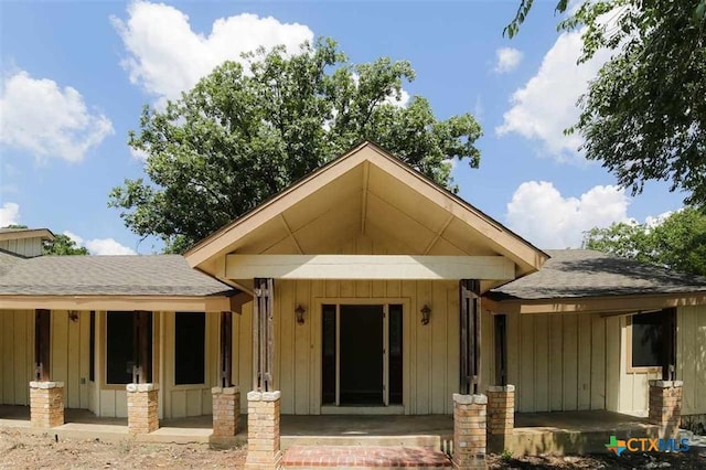 3512 Magnolia Blvd, Temple, TX 76502 - entrance to property with a shingled roof, board and batten siding, and a patio area