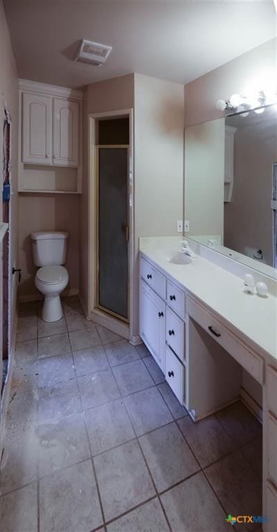 3512 Magnolia Blvd, Temple, TX 76502 - full bath with vanity, a shower stall, toilet, and tile patterned floors