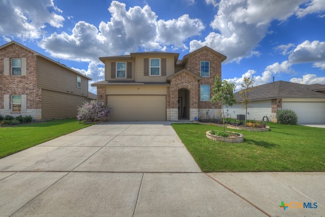 front facade featuring a garage and a front yard