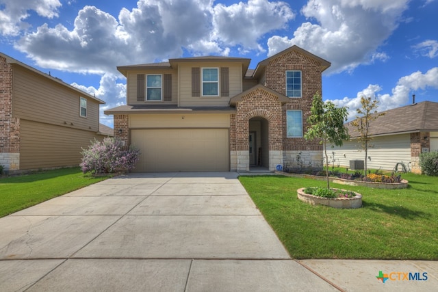 view of property with a front yard and a garage