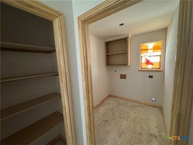 clothes washing area with carpet flooring and baseboards