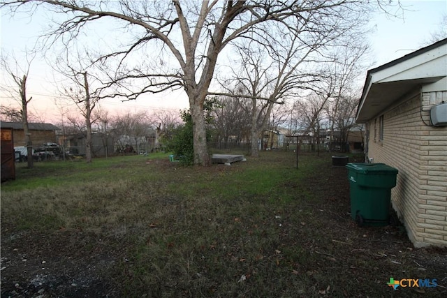 view of yard at dusk