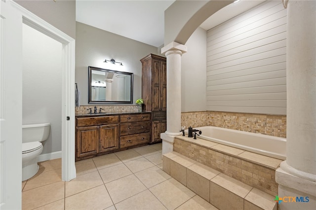1448 Decanter Dr, New Braunfels, TX 78132 - full bathroom with decorative columns, a garden tub, vanity, and tile patterned floors