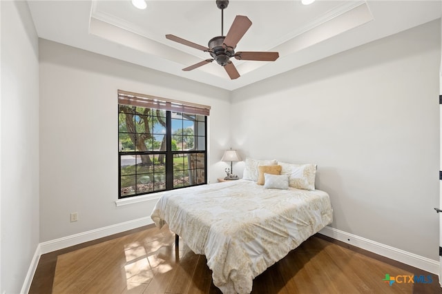 1448 Decanter Dr, New Braunfels, TX 78132 - bedroom with a tray ceiling, wood finished floors, ornamental molding, recessed lighting, and a ceiling fan