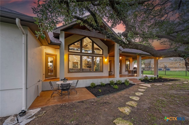 1448 Decanter Dr, New Braunfels, TX 78132 - rear view of house with covered porch and stucco siding