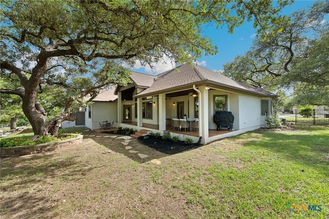 1448 Decanter Dr, New Braunfels, TX 78132 - view of side of home with a patio area, roof with shingles, and stucco siding