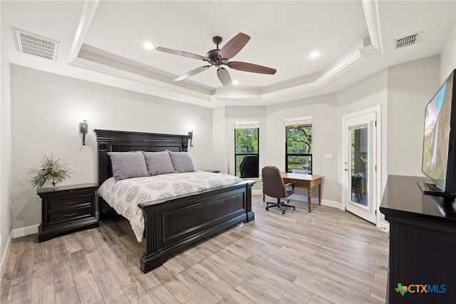 1448 Decanter Dr, New Braunfels, TX 78132 - bedroom with a tray ceiling, a desk, access to exterior, light wood-style flooring, and crown molding