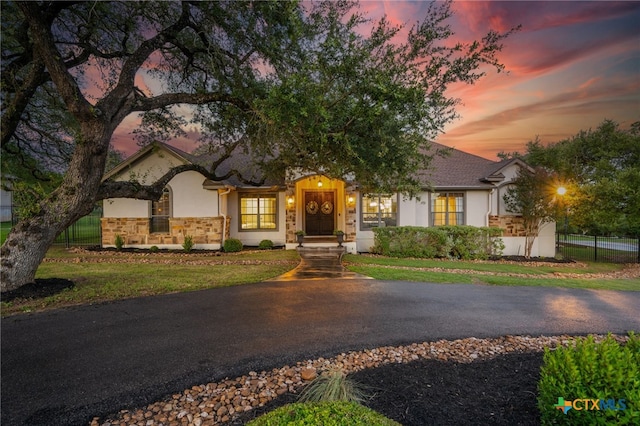 1448 Decanter Dr, New Braunfels, TX 78132 - view of front of property with stucco siding and stone siding