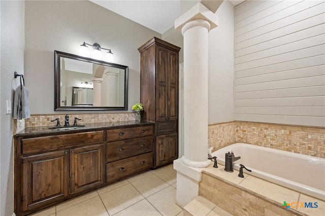 1448 Decanter Dr, New Braunfels, TX 78132 - full bath with ornate columns, a garden tub, vanity, tile patterned flooring, and backsplash