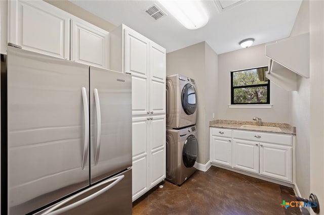 1448 Decanter Dr, New Braunfels, TX 78132 - washroom with stacked washer / dryer and baseboards