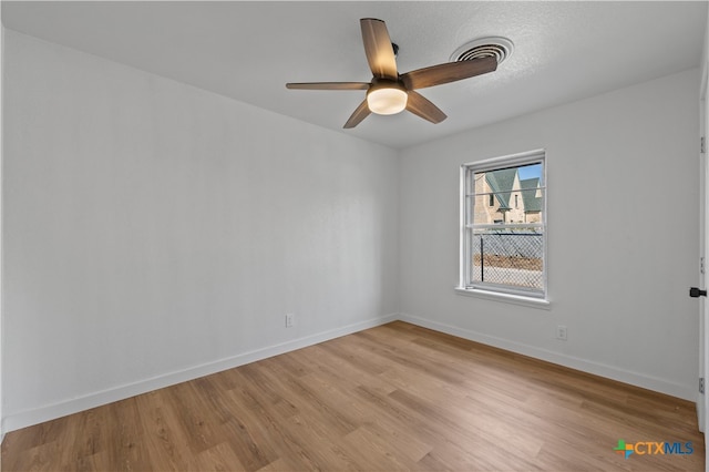 unfurnished room featuring light wood-type flooring and ceiling fan