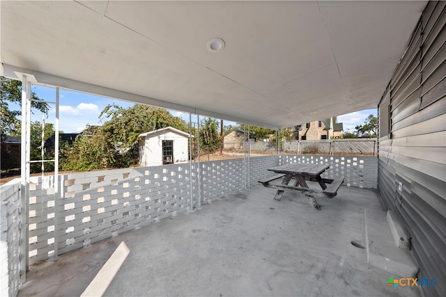 view of patio / terrace with a storage shed