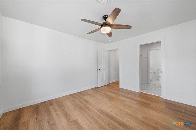 unfurnished bedroom featuring light hardwood / wood-style floors, ceiling fan, and ensuite bath