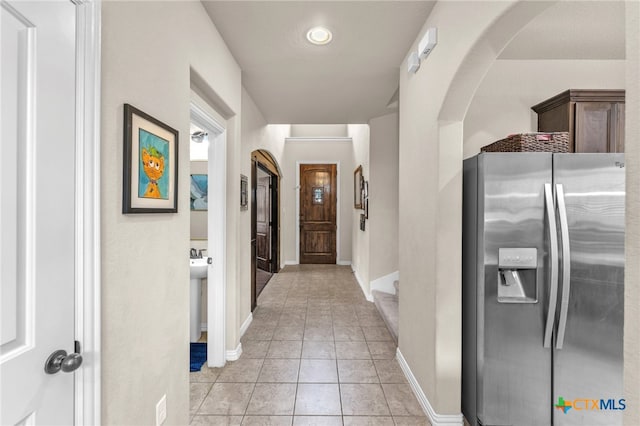 hallway featuring light tile patterned flooring