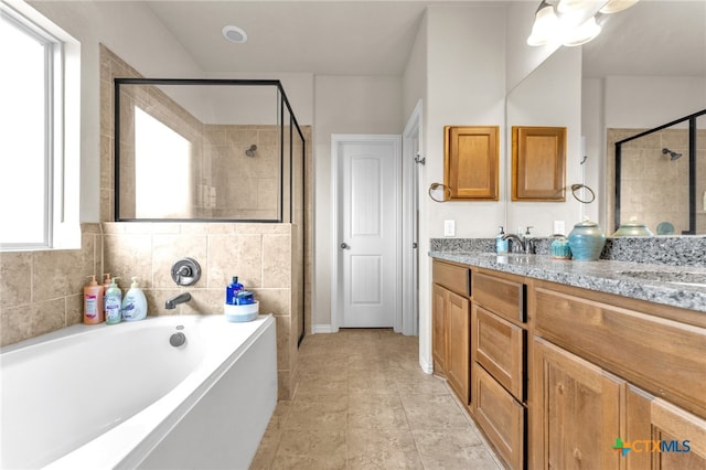 bathroom featuring vanity, tile patterned floors, and plus walk in shower