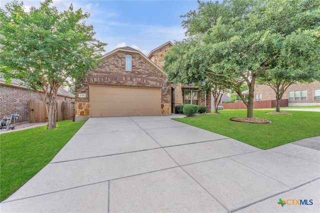 view of front of property featuring a garage and a front yard