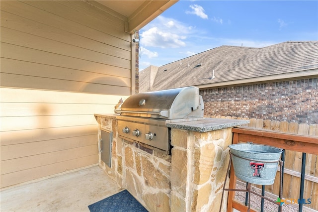 view of patio / terrace featuring an outdoor kitchen and area for grilling