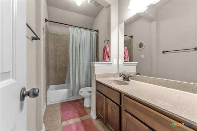 full bathroom featuring tile patterned floors, vanity, shower / bath combo with shower curtain, and toilet