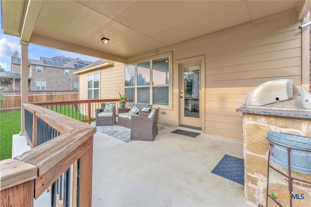 view of patio featuring an outdoor living space and exterior kitchen