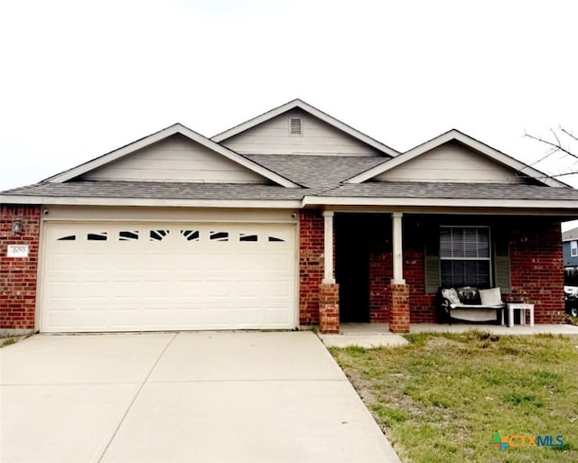 ranch-style home with covered porch, brick siding, driveway, and an attached garage