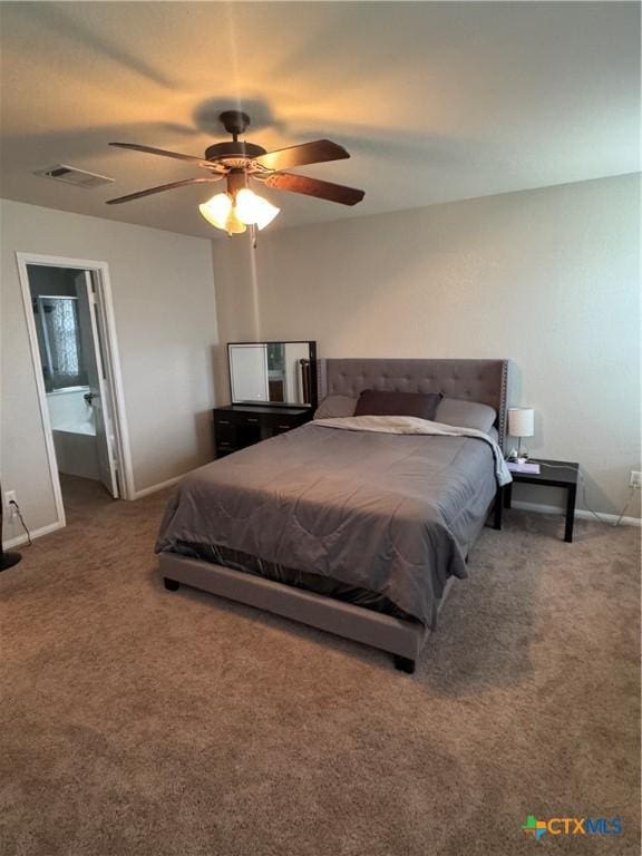 bedroom featuring carpet, visible vents, a ceiling fan, ensuite bath, and baseboards