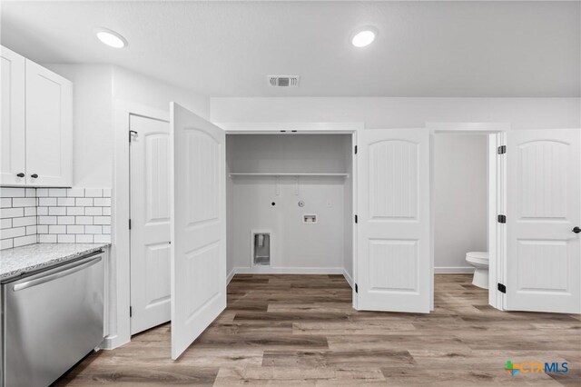 614 S 24th St, Temple, TX 76501 - washroom featuring hookup for a washing machine, wood finished floors, baseboards, and recessed lighting