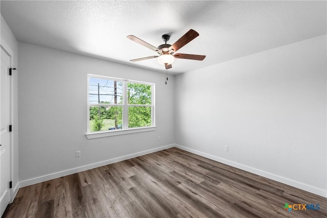614 S 24th St, Temple, TX 76501 - empty room featuring wood finished floors, a ceiling fan, baseboards, and a textured ceiling