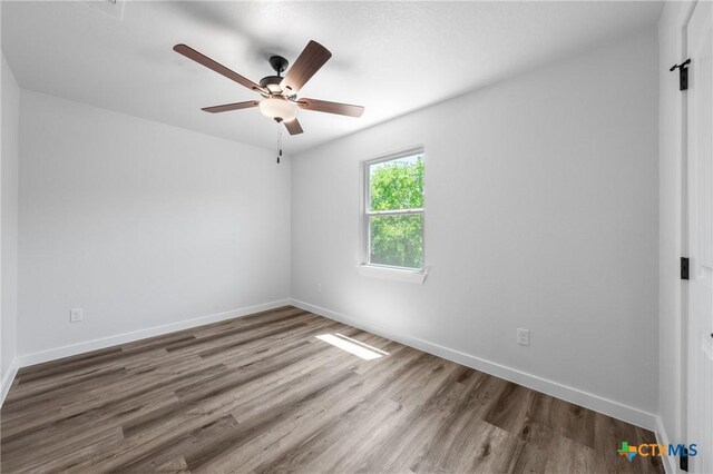 614 S 24th St, Temple, TX 76501 - empty room with a ceiling fan, wood finished floors, and baseboards