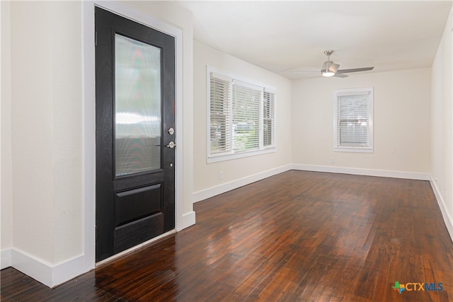 entrance foyer featuring dark hardwood / wood-style flooring and ceiling fan