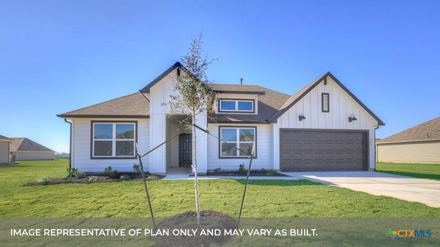 193 Zane Saddle Rd, Lockhart, TX 78644 - view of front of property featuring an attached garage, board and batten siding, driveway, a front lawn, and a shingled roof