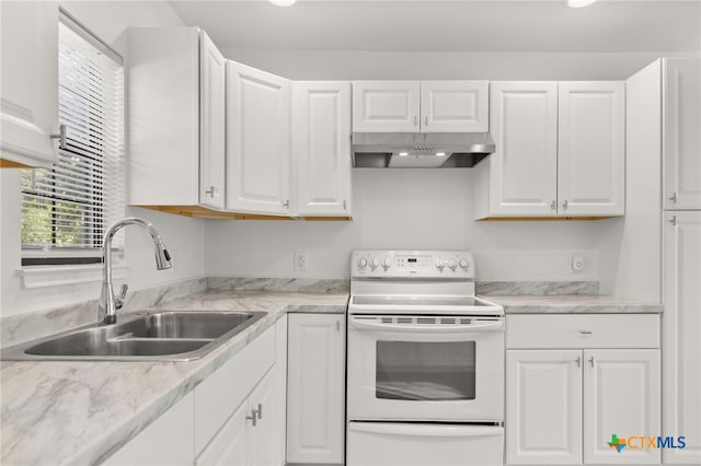 kitchen featuring white cabinetry, electric stove, under cabinet range hood, and a sink