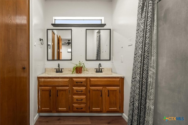 bathroom featuring vanity and hardwood / wood-style floors