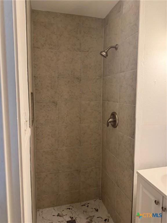 4912 Evergreen Ln, Victoria, TX 77904 - bathroom featuring tiled shower and vanity