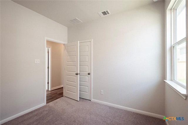 201 Escape Way, Jarrell, TX 76537 - carpeted spare room featuring baseboards