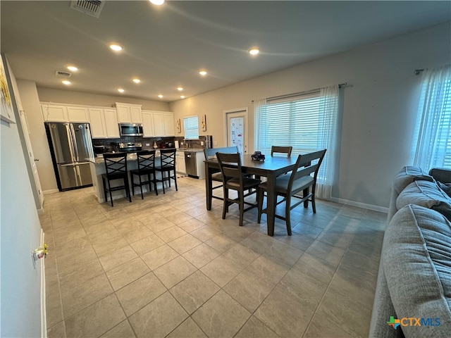 dining room with light tile patterned floors