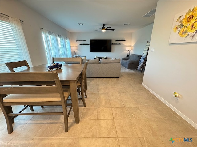 dining room featuring ceiling fan and light tile patterned floors